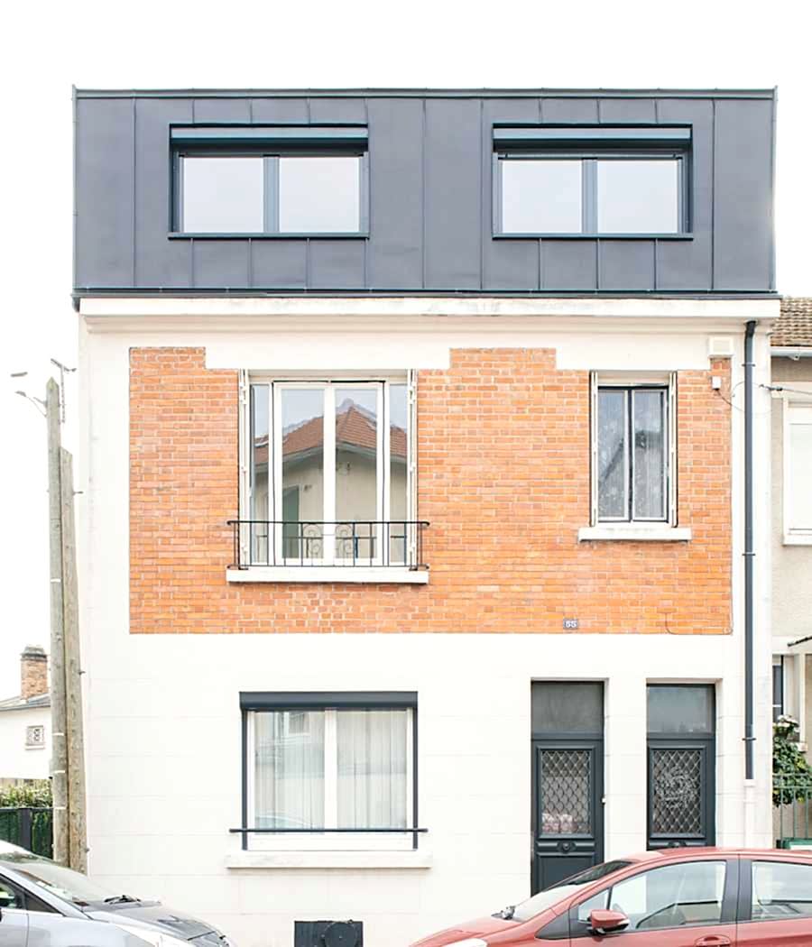 Surélévation d'une maison de ville - aménagement des combles - vue entière de la façade 