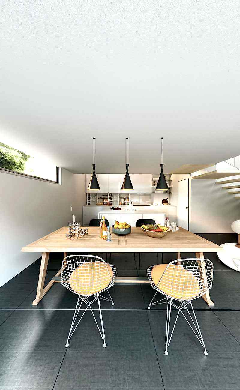 Réhabilitation d'un hangar en loft - cuisine avec table à manger